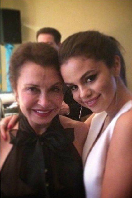 Selena at Golden Globe's afterparty with a fan