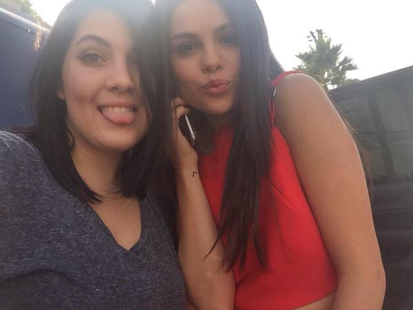 Selena with a fan near 97.1 AMP Radio studio