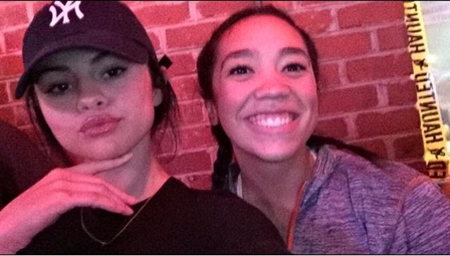 Selena with a fan at Texas Roadhouse