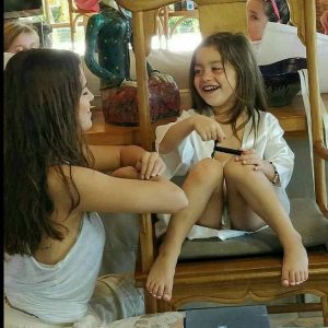 Selena with a little fan in Jamaica