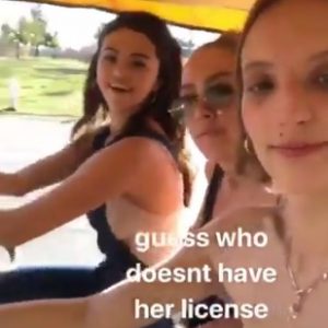 Selena riding a bike with friends, video from Petra Collins’s Instagram Story