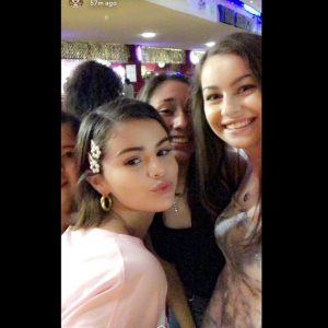 More pics of Selena with fans at Moonlight Rollerway in CA