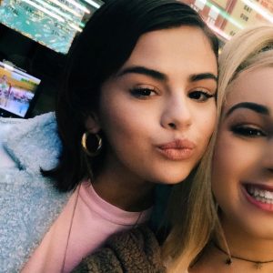 Selena with a fan at Moonlight Rollerway in CA