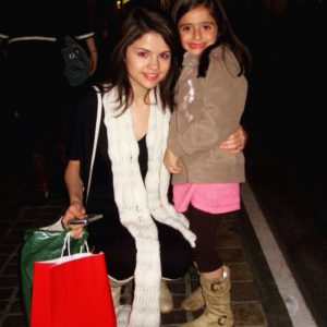 5 September Selena with the same fan in 2008 and tonight at Coach Event