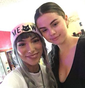 8 May Selena with a fan at the roller rink in California