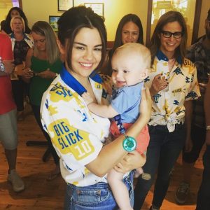 8 June Selena with a fan’s child at The Big Slick in Kansas