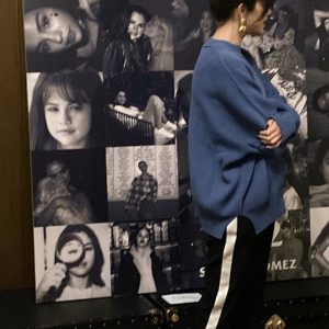 12 December Selena getting candys from fans at Rare secret listening session in London