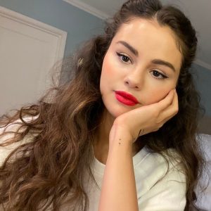 25 March @RareBeauty on Instagram: We stan @selenagomez’s signature look with a bold red lip