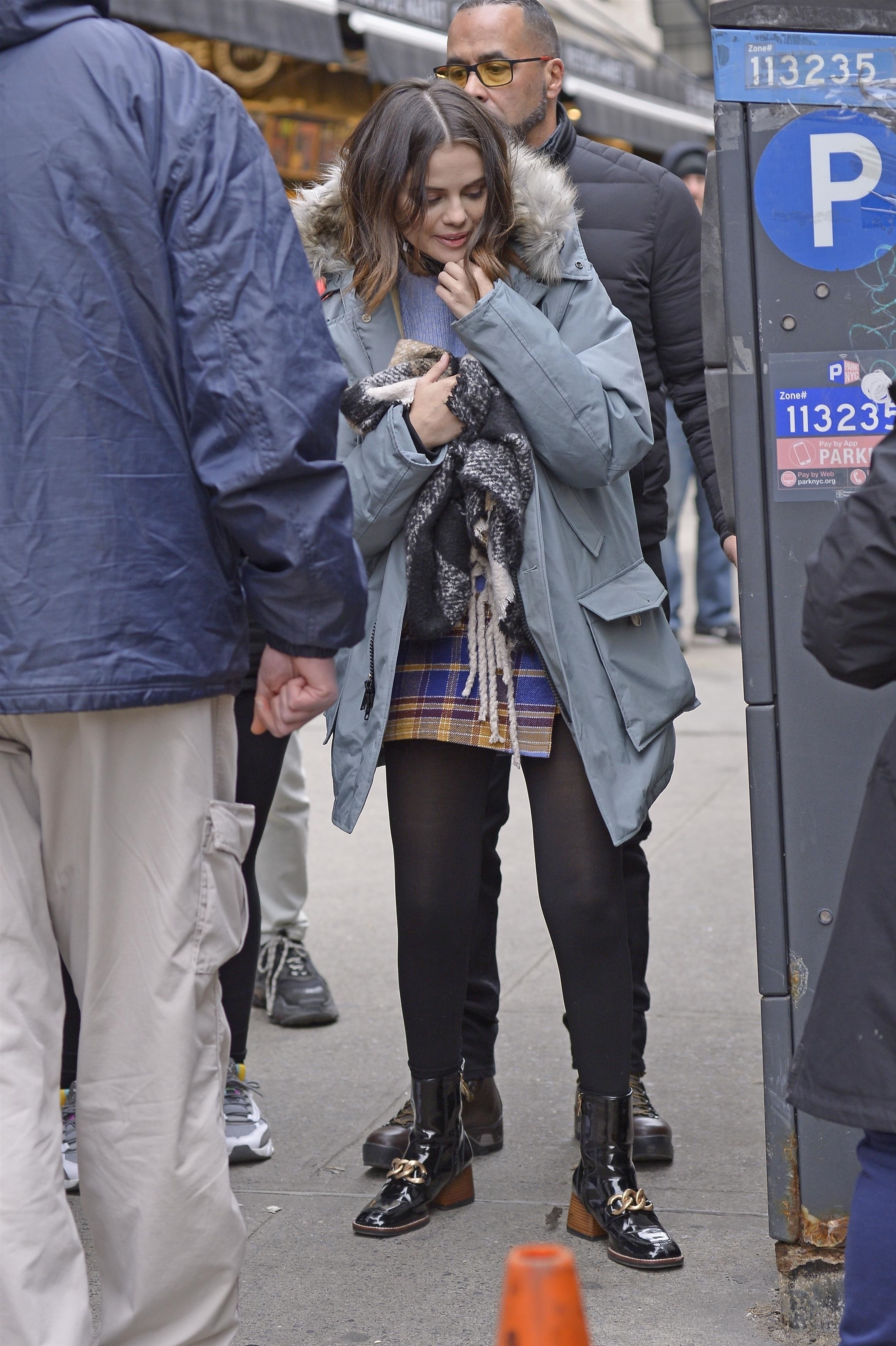 Selena Gomez wears a fur coat, black pants and Gucci shoes in New York City