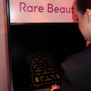 18 April: Selena plays video game at the Rare Beauty Event