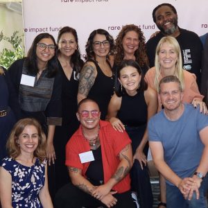 31 October: Selena poses with her Rare Beauty team at the Rare Impact Fund event